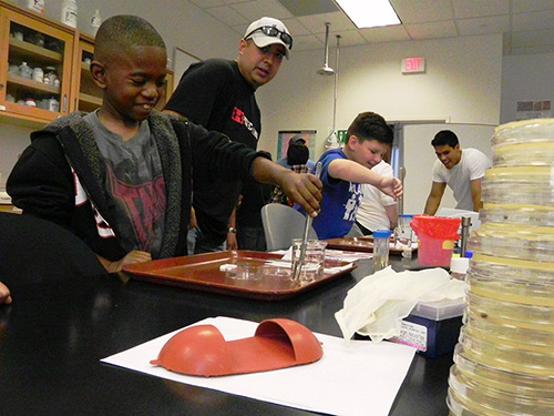 Rowland Elementary School students work with University of Houston-Victoria biology students