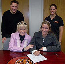 Seated (L-R) Marsha Glowney (Izzy's mom); Izzy Glowney
Standing (L-R) Ashley Walyuchow, UHV athletic director; Keri Lambeth, UHV head softball coach