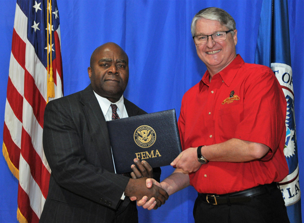 Stuart Sherman, UHV emergency management assistant fire marshal, graduates from FEMA’S Emergency Management Institute on March 29 and is congratulated by Tony Russell, superintendent of the FEMA Institute in Emmitsburg, Md.