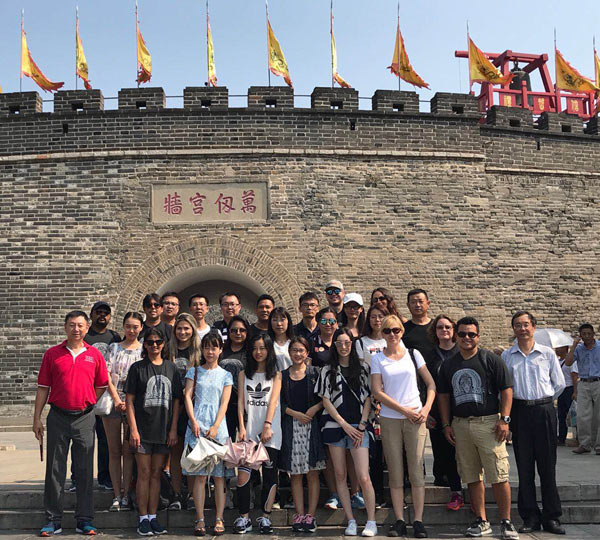 Students and faculty from UHV and two Chinese universities stand at the entrance to Chinese teacher and philosopher Confucius’ hometown